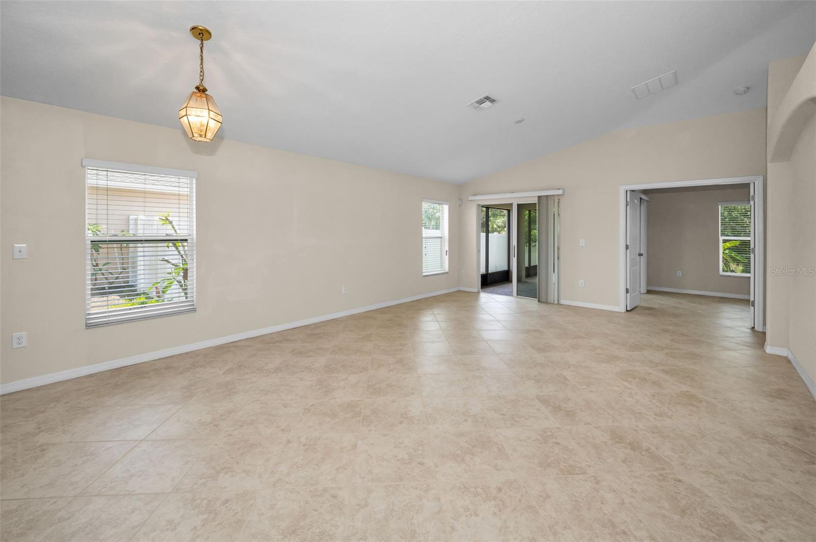 Familyroom with sliders out to pavered lanai
