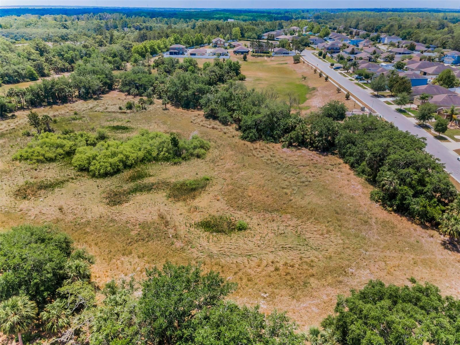Aerial view of home and backyard area.