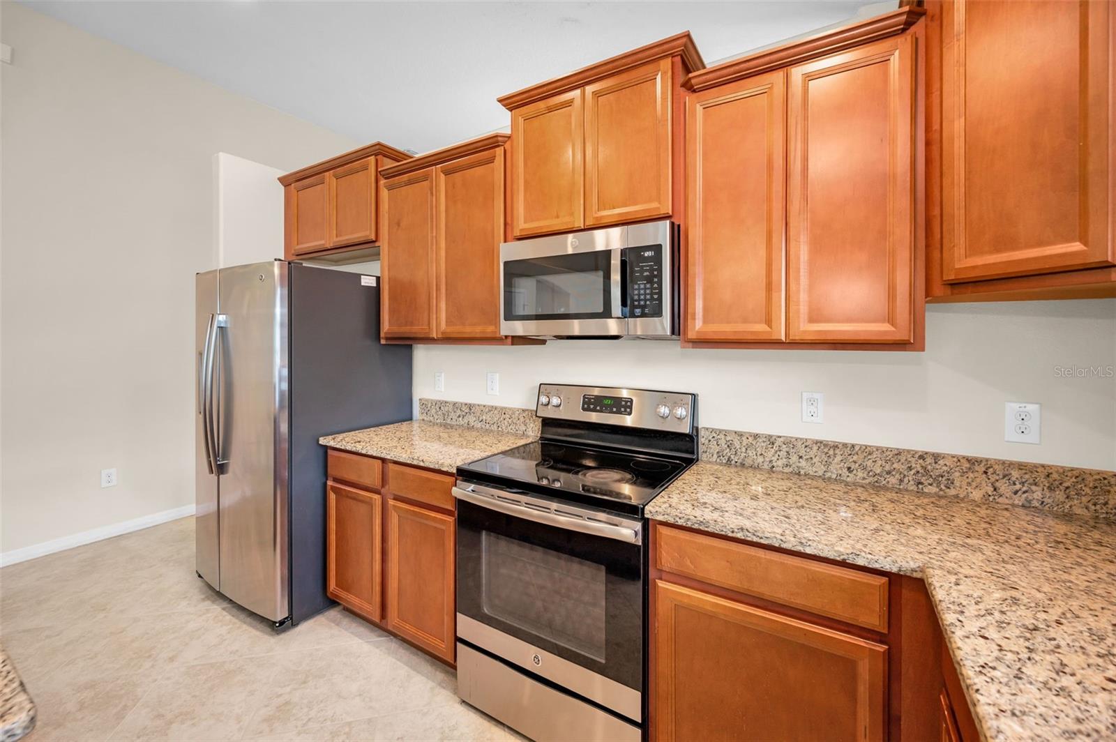 Beautiful kitchen with custom cabinetry, granite countertops and stainless steel appliances.