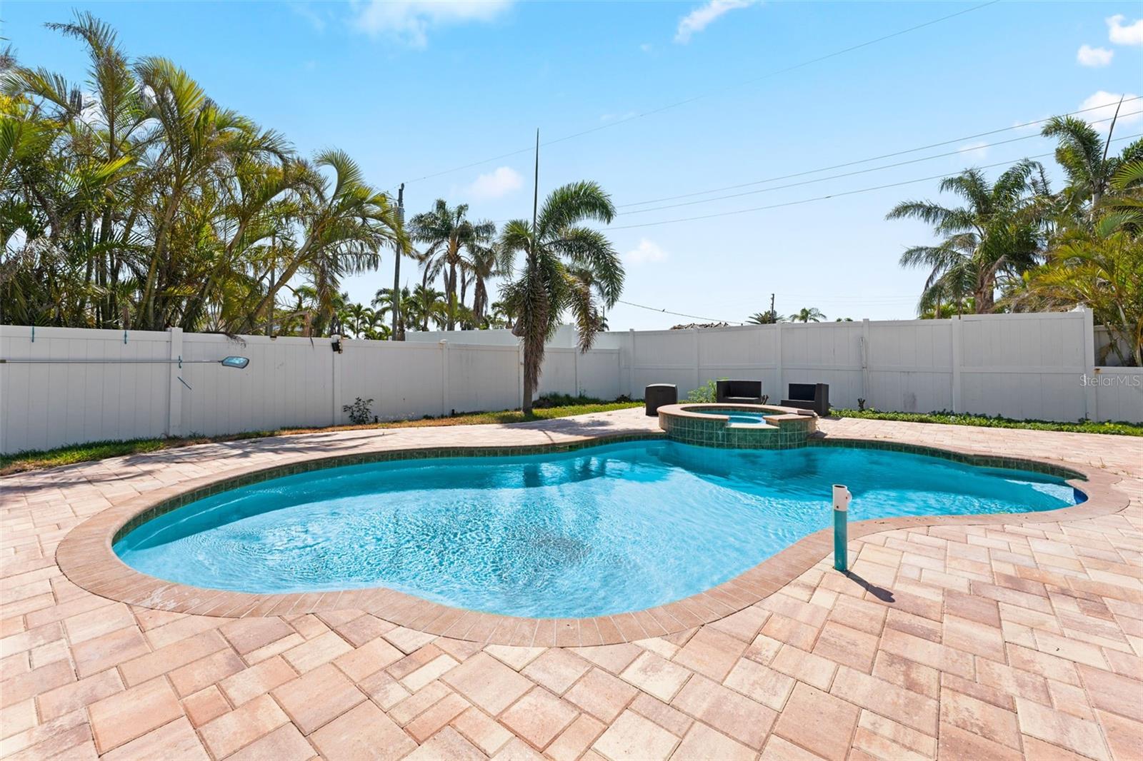 The back yard has gorgeous pavers!