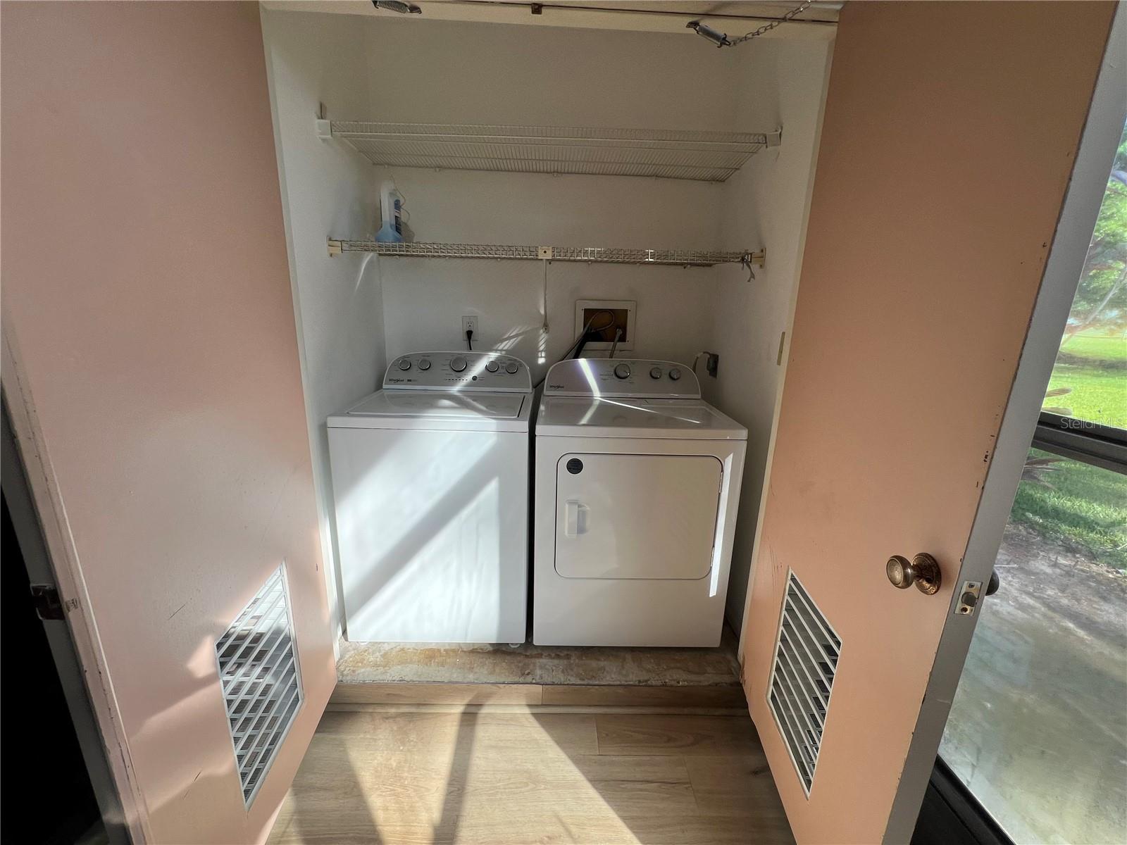 Laundry room with brand new washer and dryer