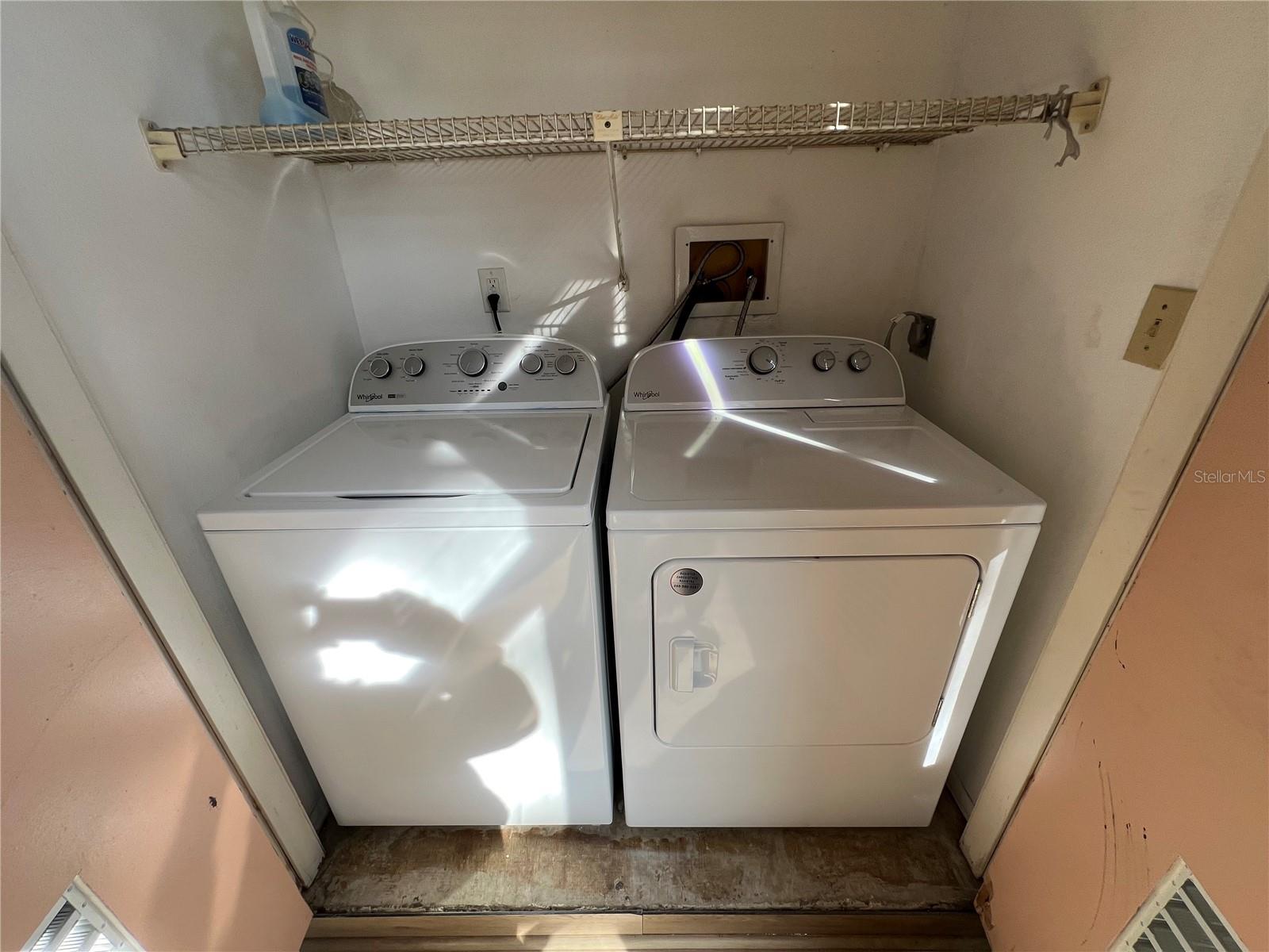 Laundry room with brand new washer and dryer