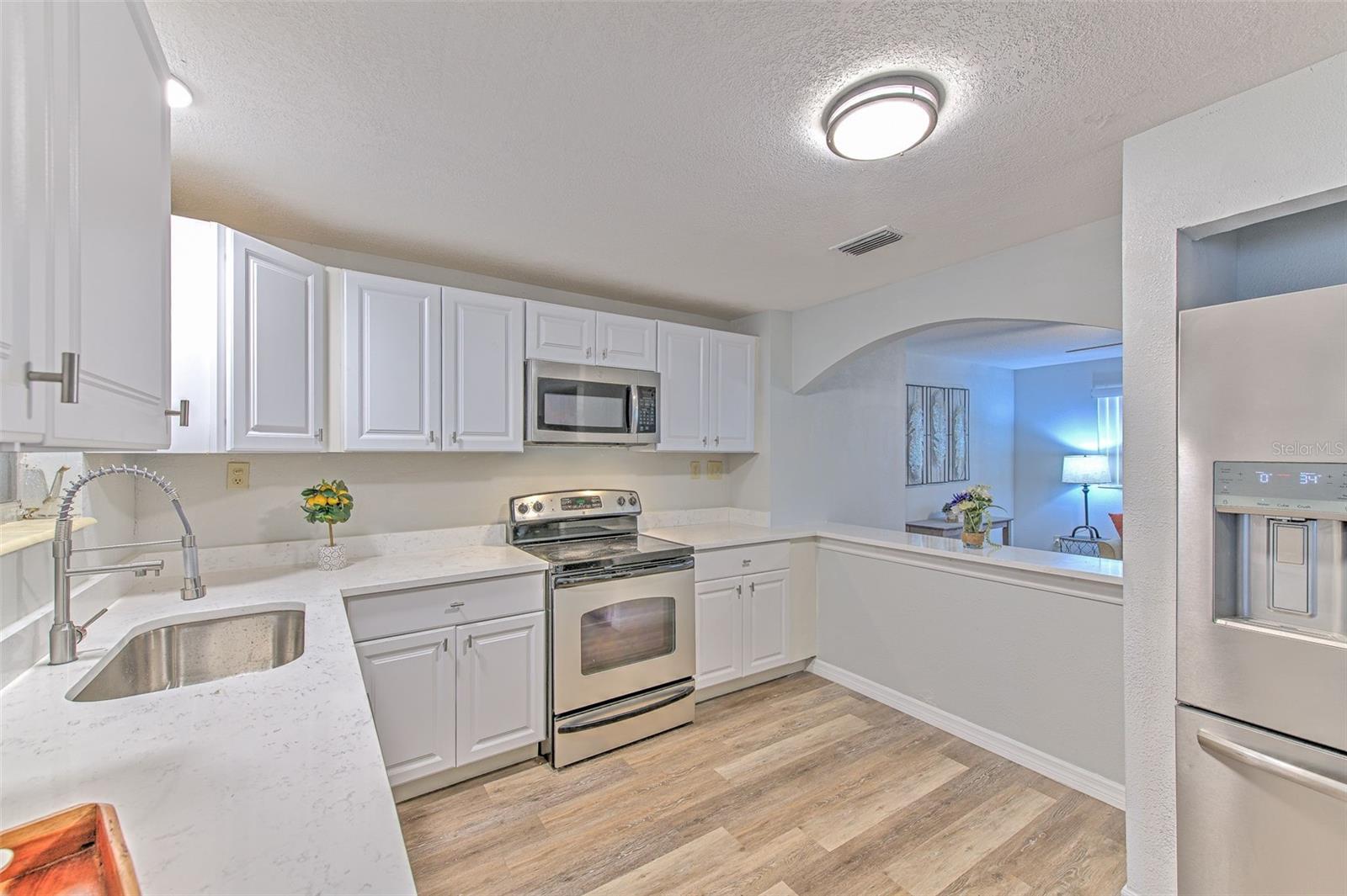 laundry room with new water heater, opens to the backyard.