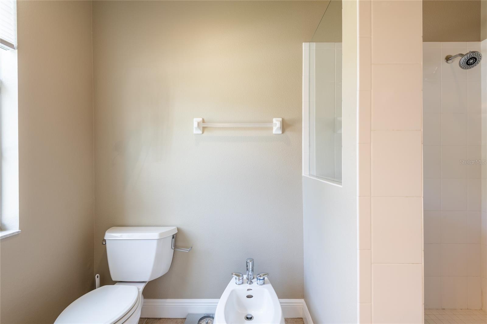 BIDET, TOILET AND WALK-IN TILED SHOWER