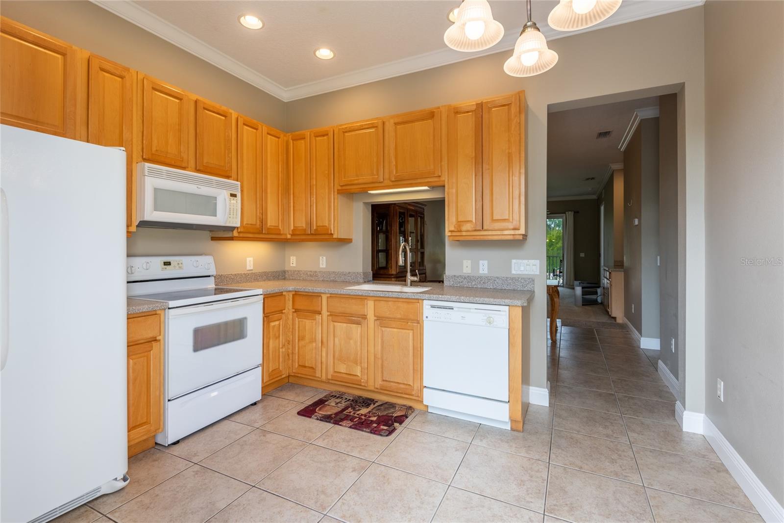 KITCHEN PASS THRU TO DINING AND LIVING AREAS