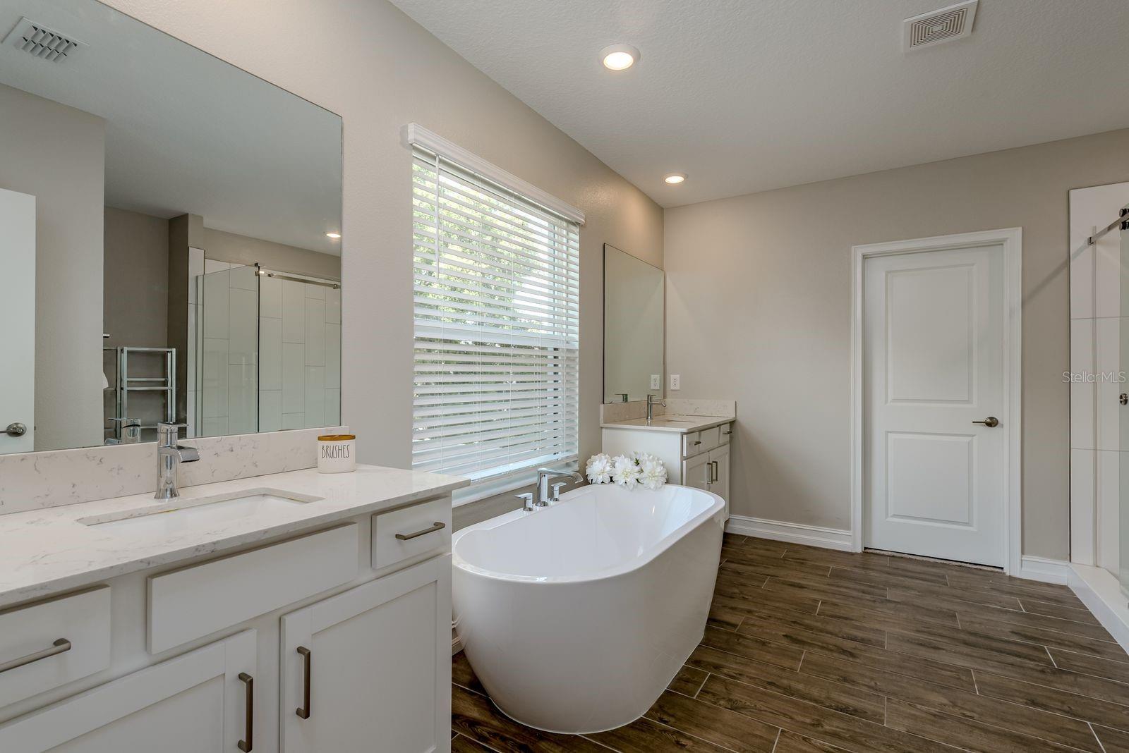 2nd floor Master ensuite with soaking tub, dual sinks with quartz counter
