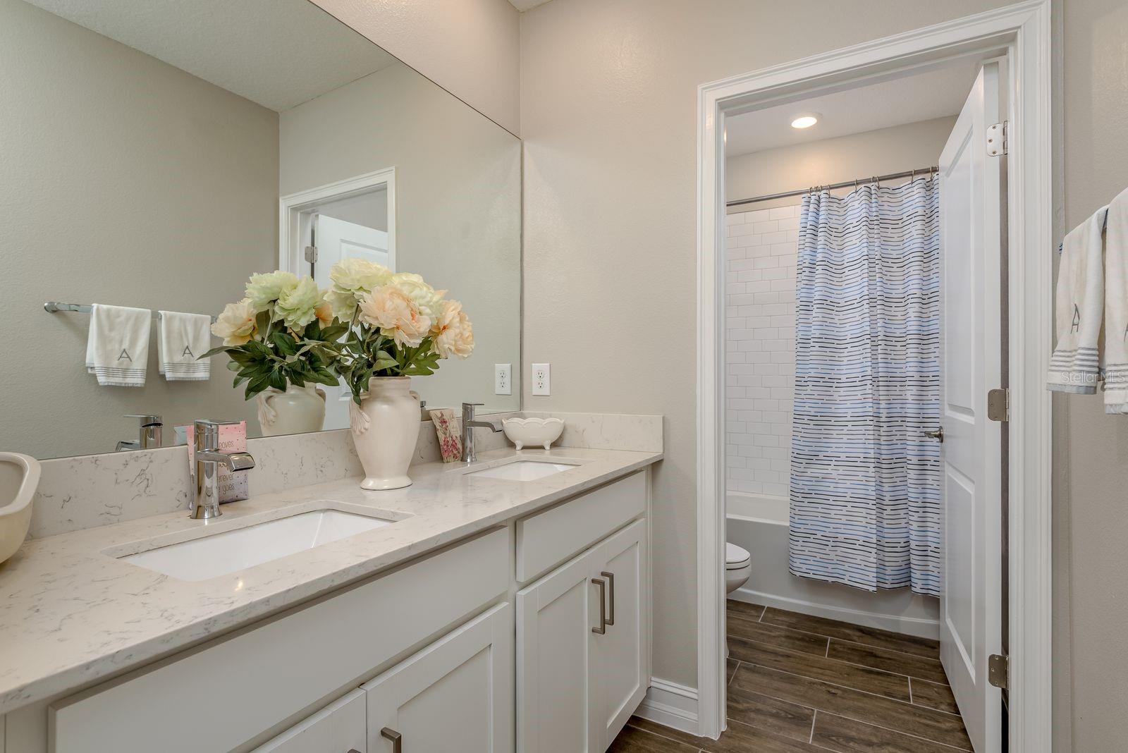 2nd floor Hall bathroom, with shower/tub and dual quartz sinks