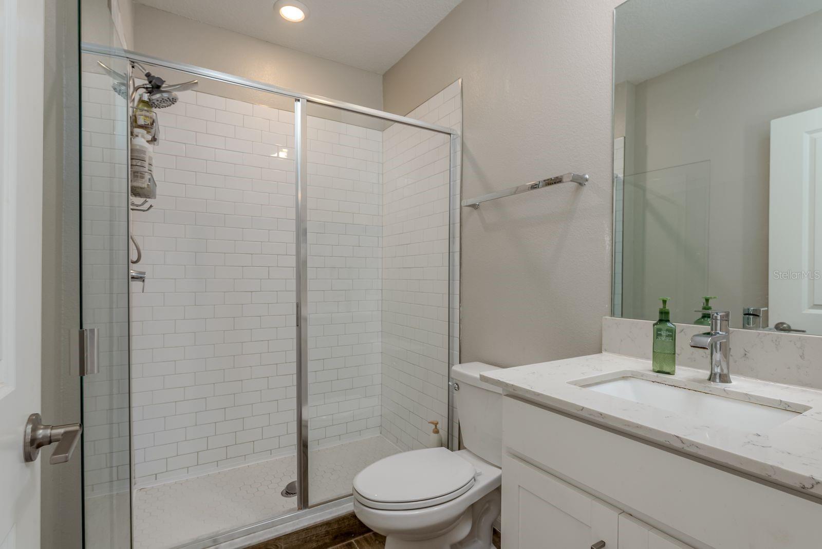 5th bedroom private bathroom with ensuite: walk in shower, quartz counter top