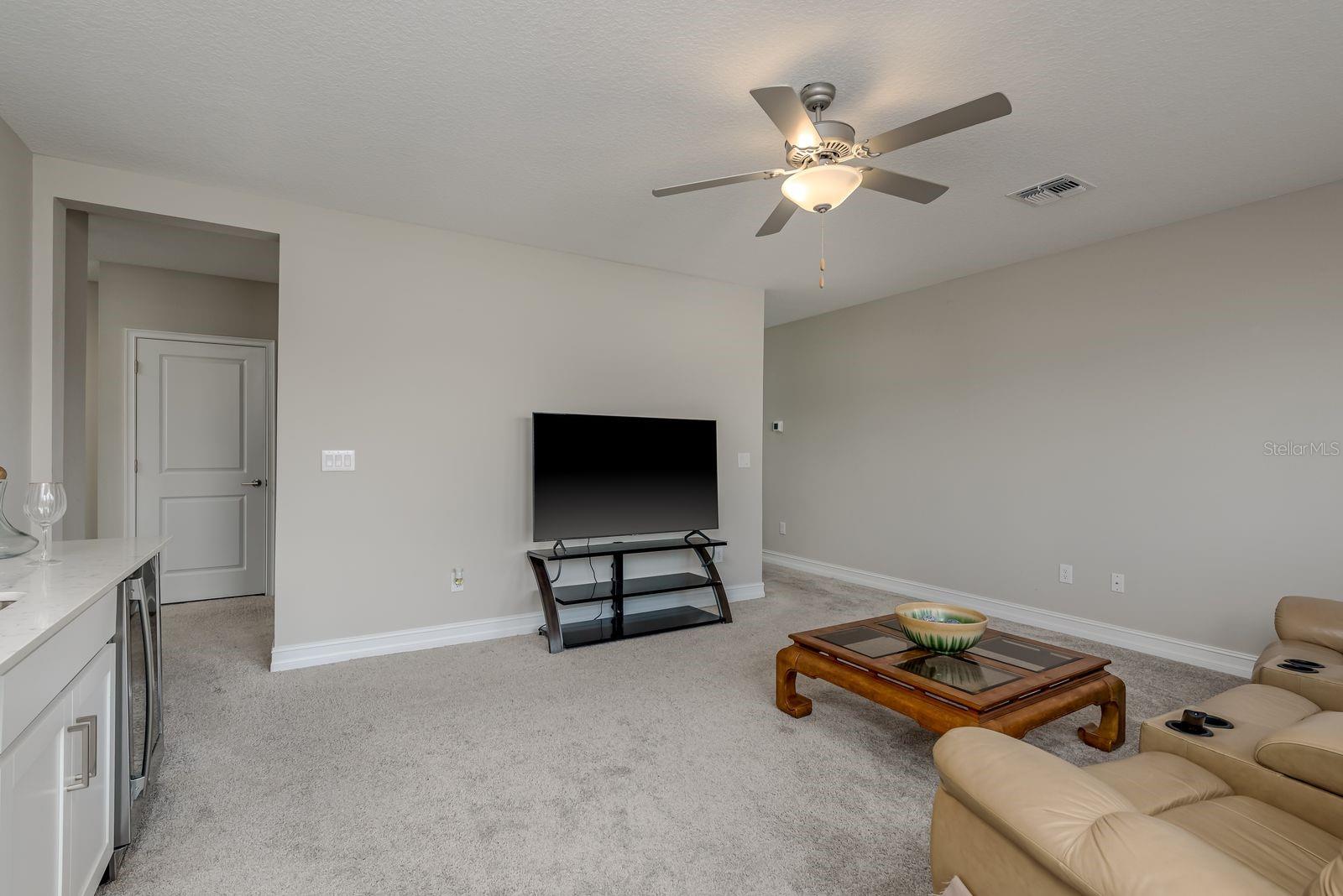 2nd floor Media room has a wet bar and  wine refrigerator