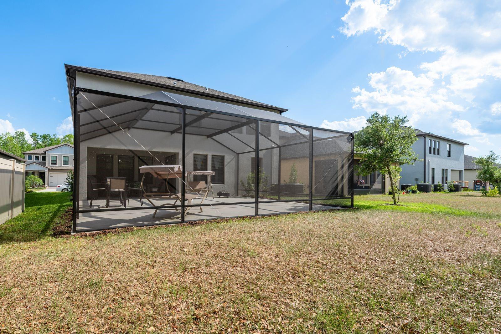 View of the back of the home.  ex large Lanai, and covered patio