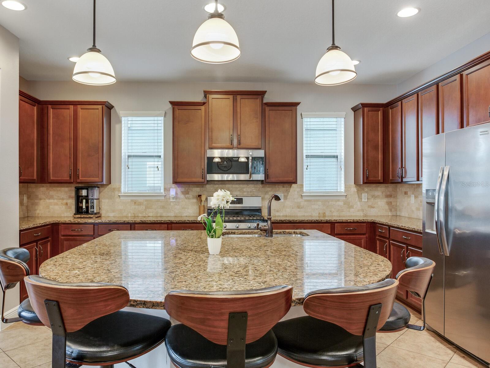 eat in kitchen with tons of wood cabinets..extended breakfast bar