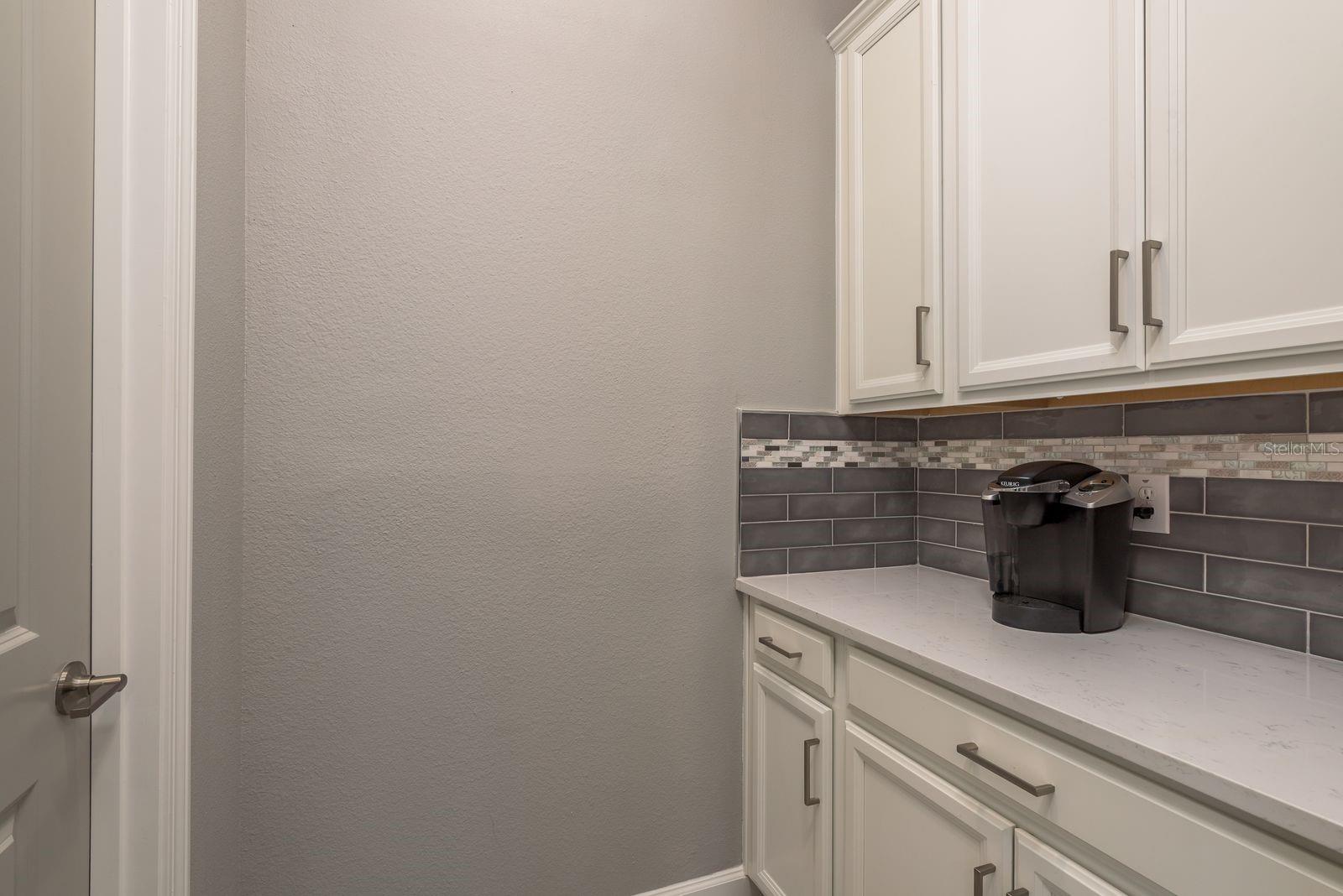Coffee Bar and entrance to large walk-in pantry