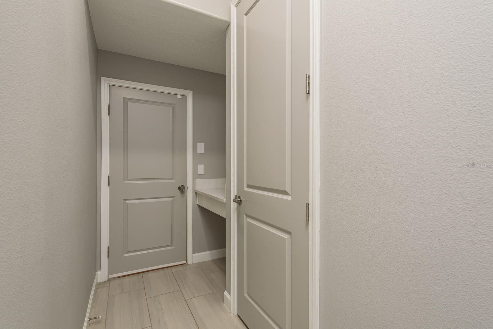Entrance from garage with package drop shelf