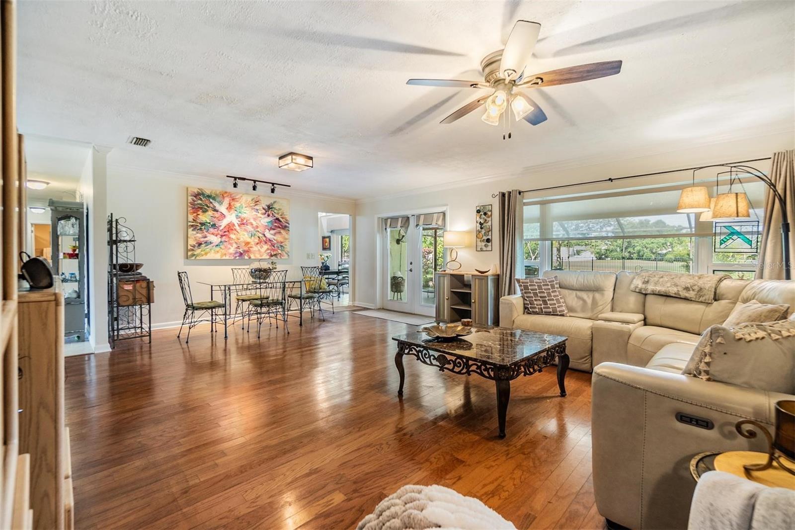 Dining area and French doors out to lanai and pool