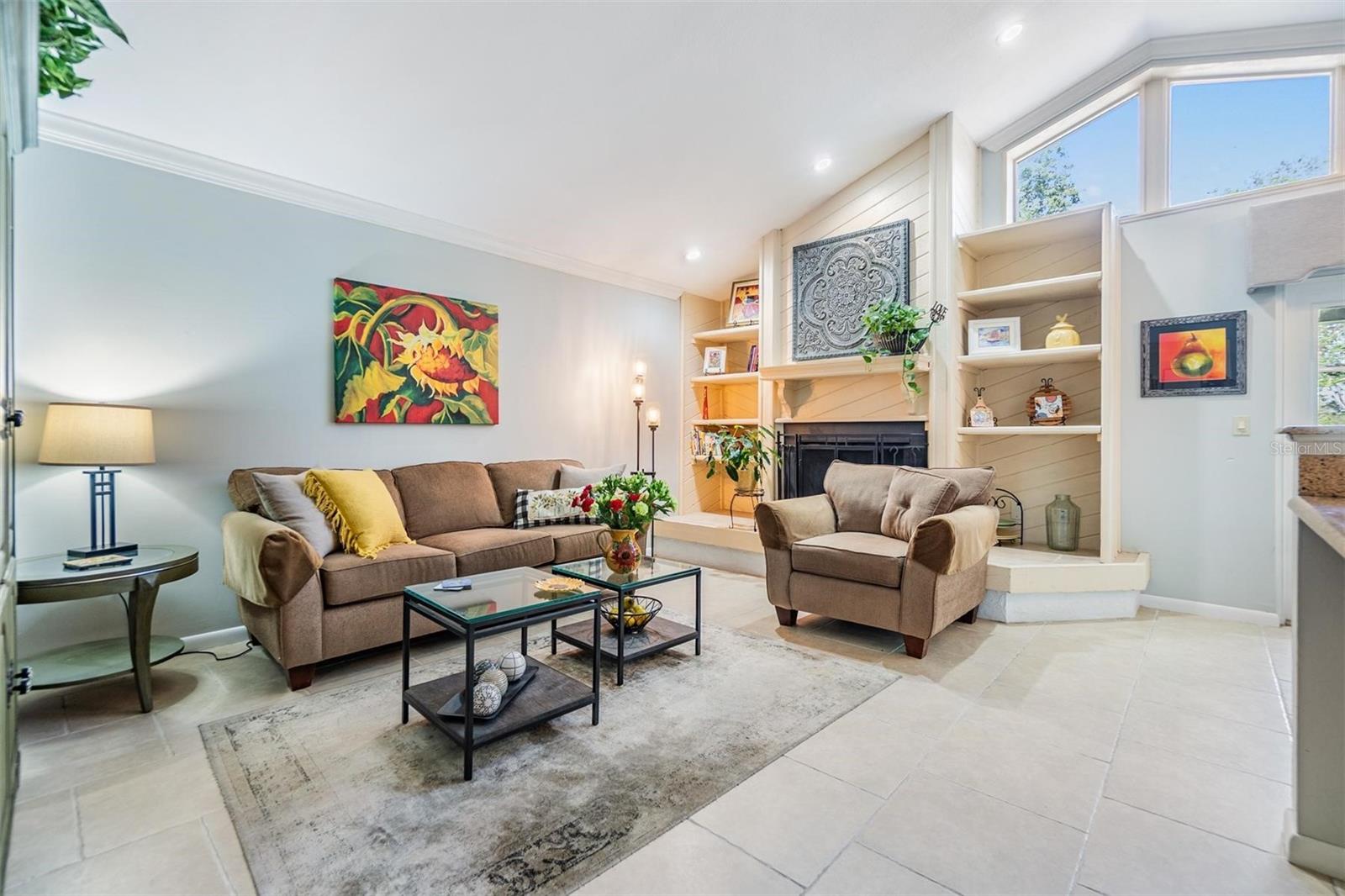 Family room with vaulted ceiling and fireplace