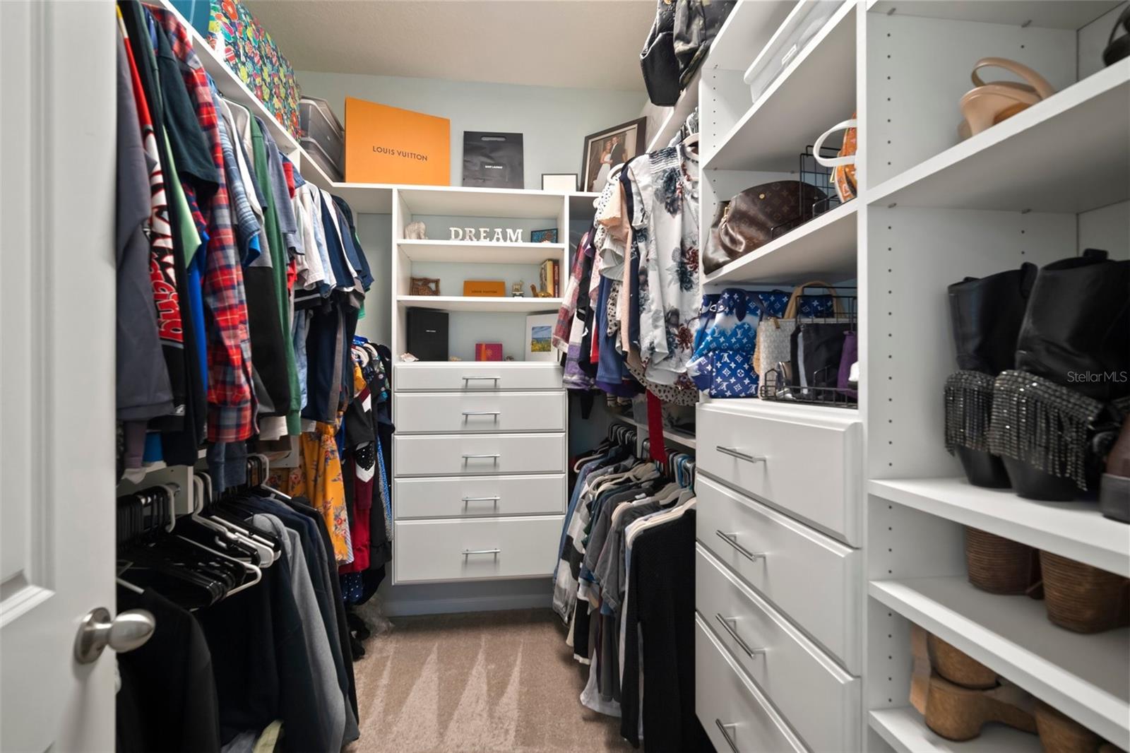 Walk-in closet with custom built in shelving