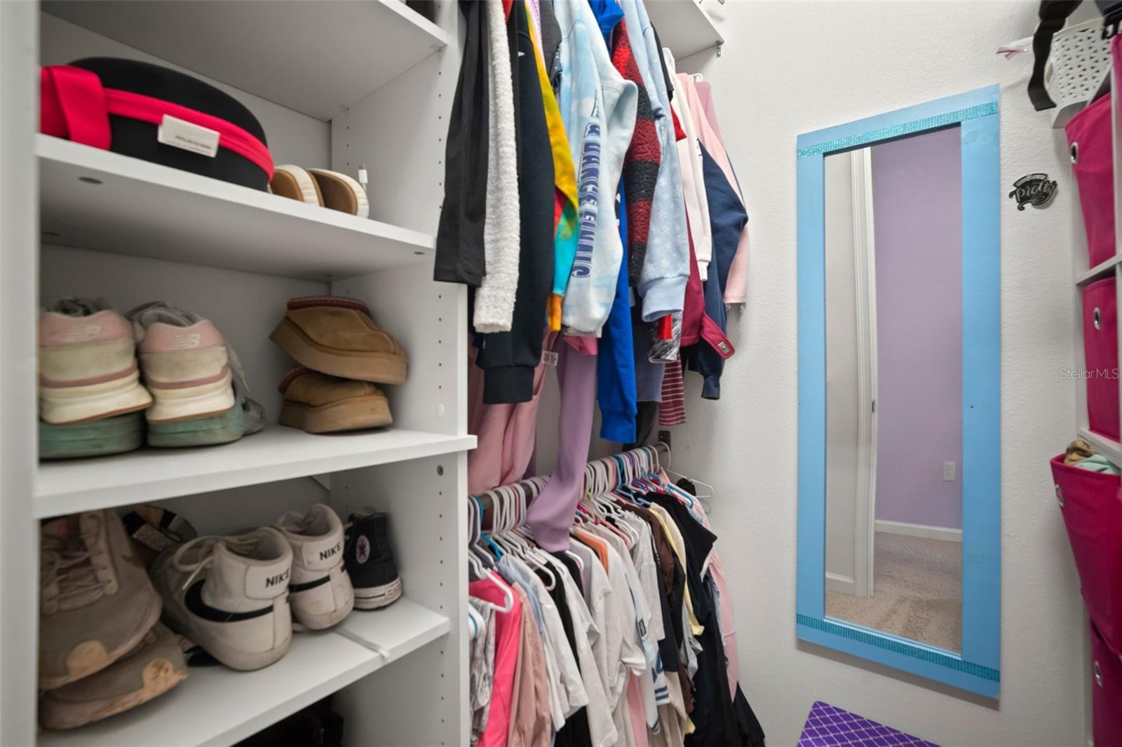 Bed 3 walk-in closet with custom built in shelving