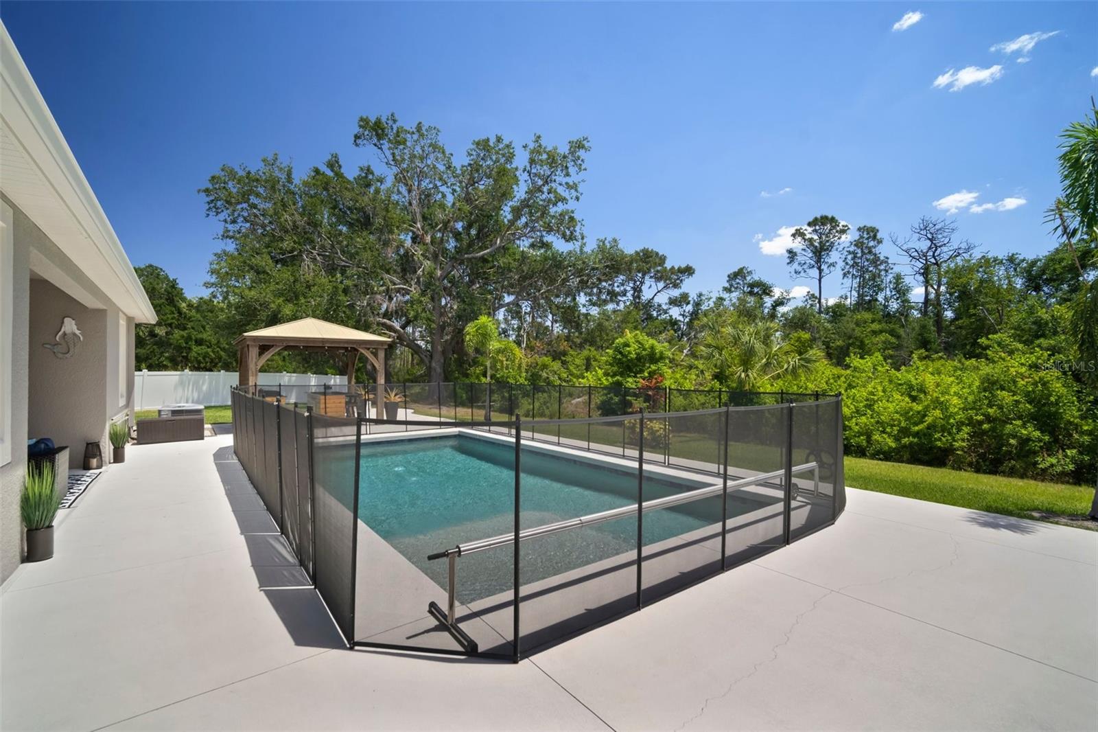 Salt water pool with safety fencing