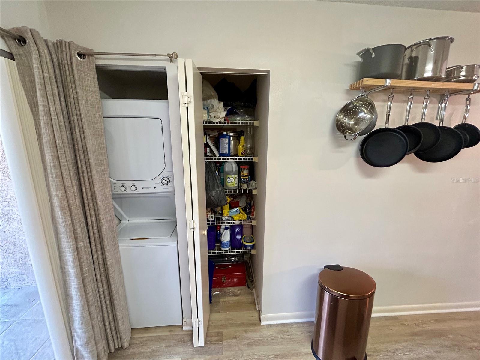 Washer & dryer and pantry closet in the kitchen