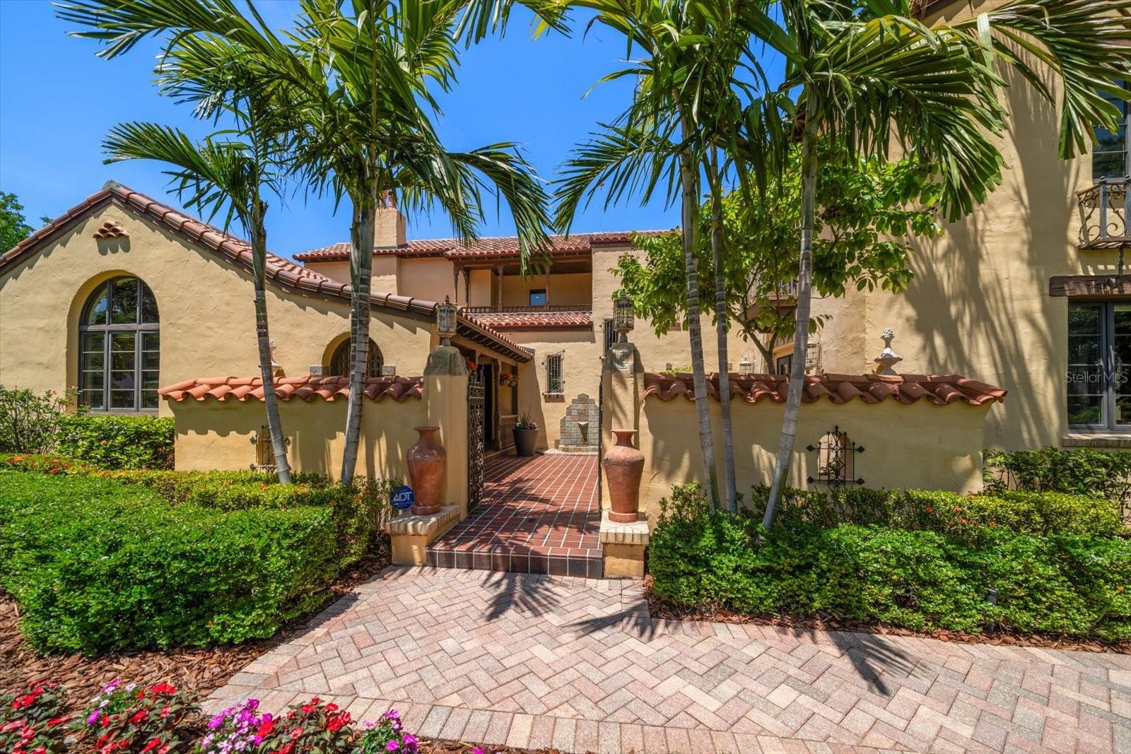Walkway to the front of the home and lovely courtyard
