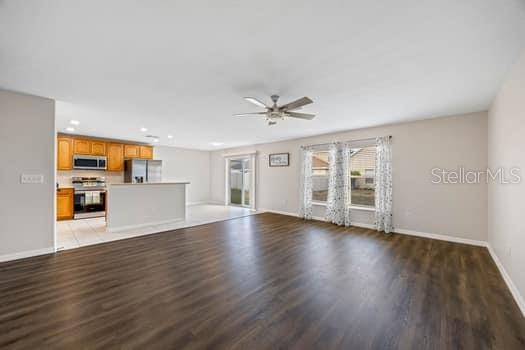 Kitchen with featuring a breakfast bar, dinette and great room