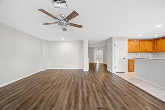 Great room with entertainment alcove - kitchen with closet pantry and breakfast bar