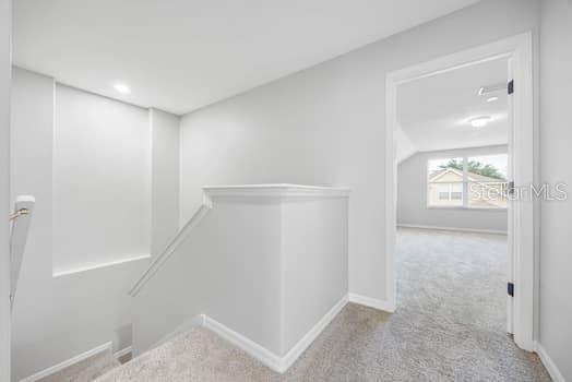 Staircase with handrails and upstairs landing - all new carpet throughout the 2nd floor