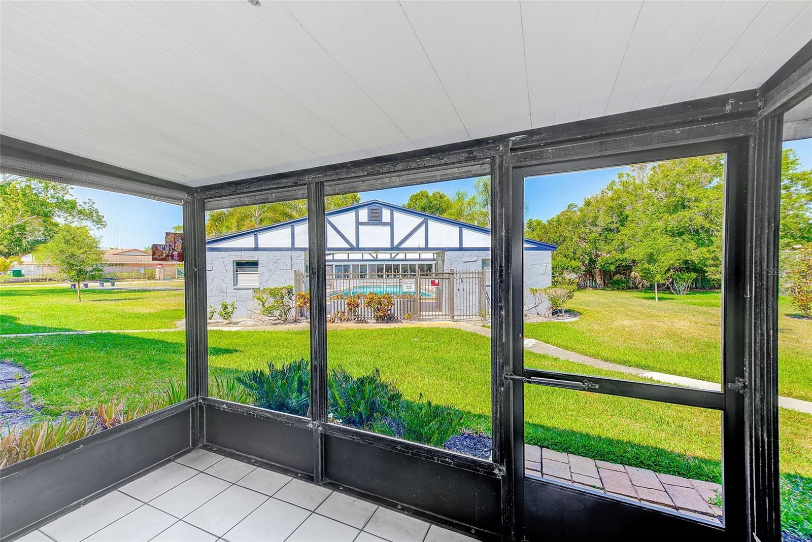 Screened Patio overlooking Pool and Tennis Courts