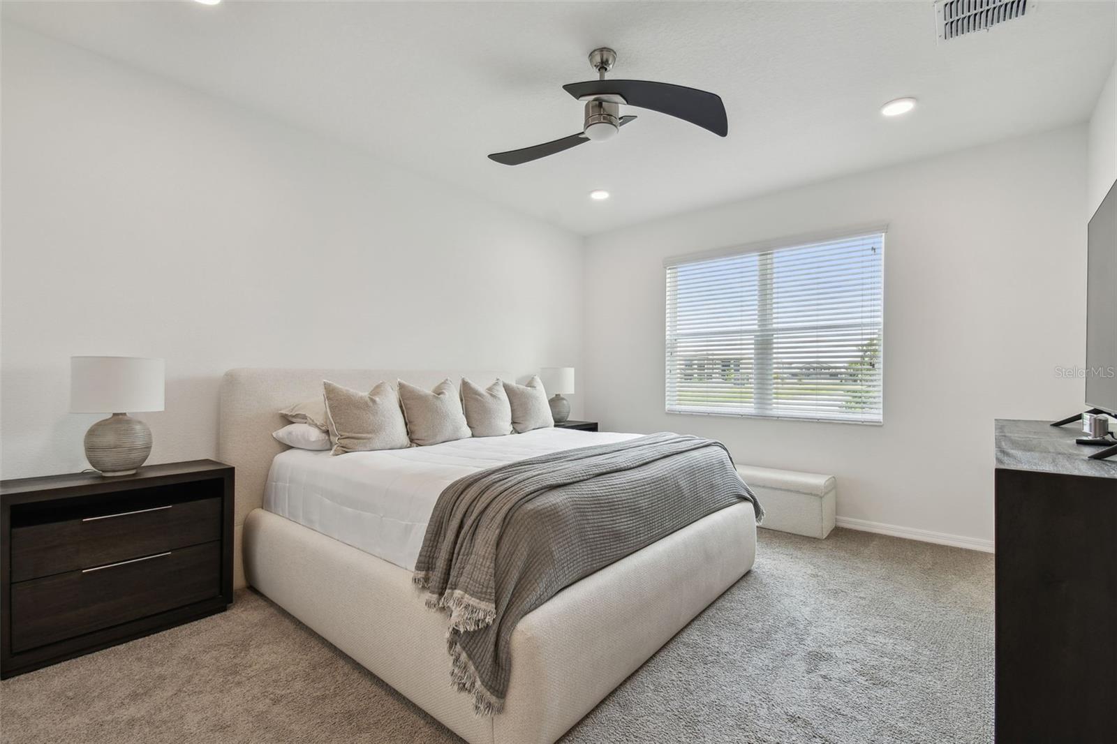 Owners suite on the main floor has plenty of space for furnishings