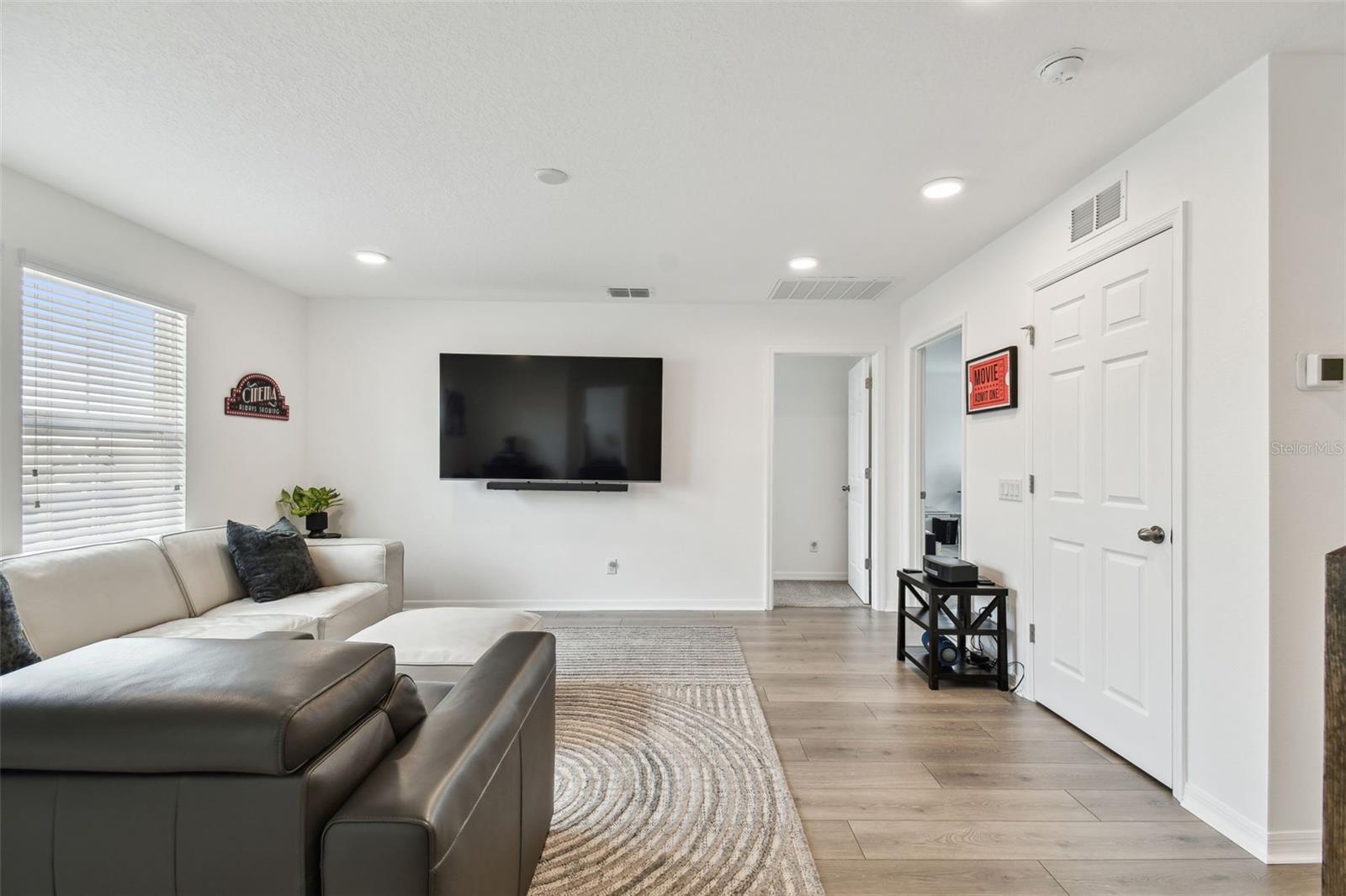This open loft space is very well sized, and a functional space. Whether you love to cheer-on your favorite teams, create a playroom, a exercise space, or even a relaxation area- this space can accomodate you!