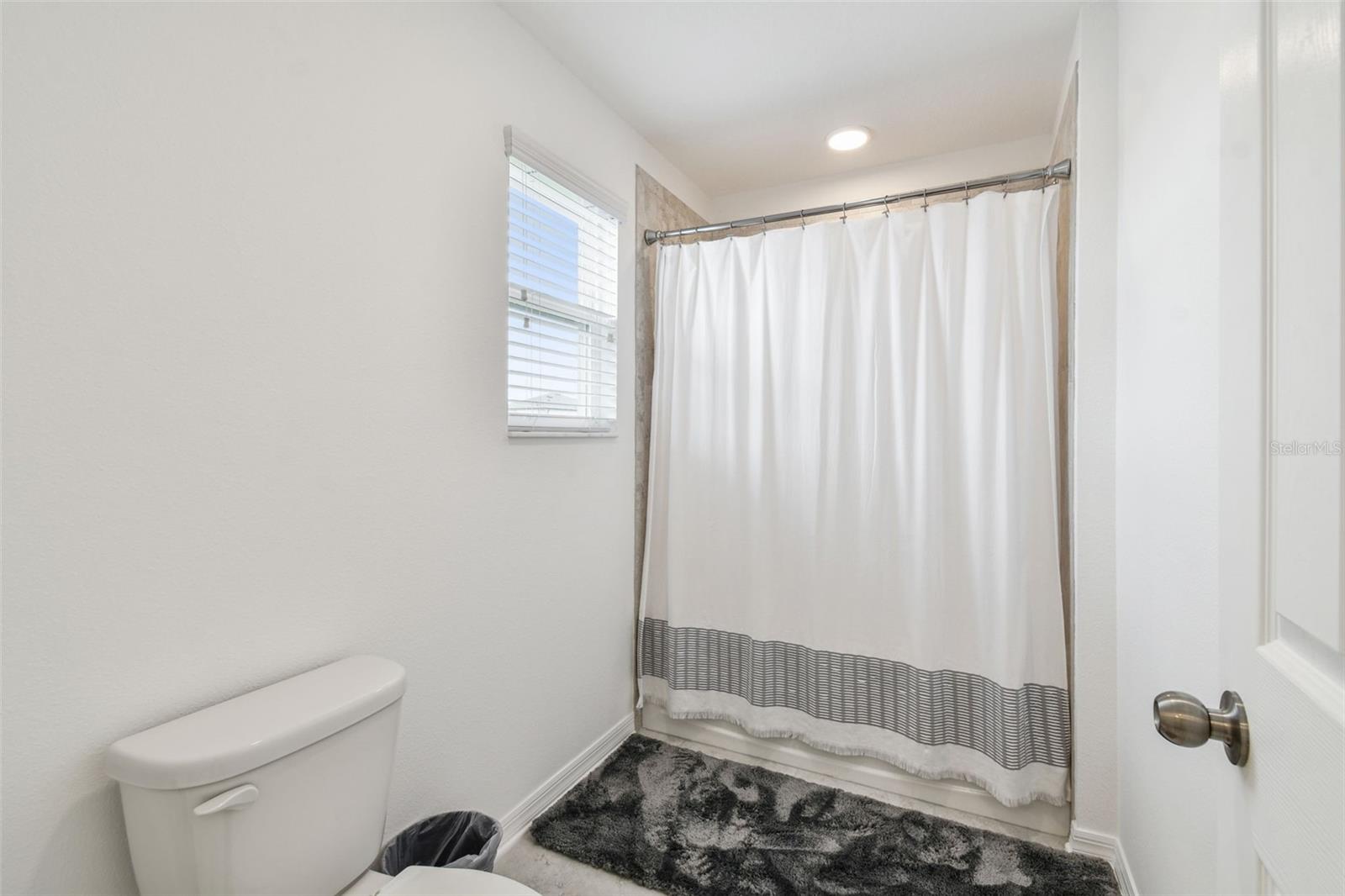 Family bath divides the space for flexible use