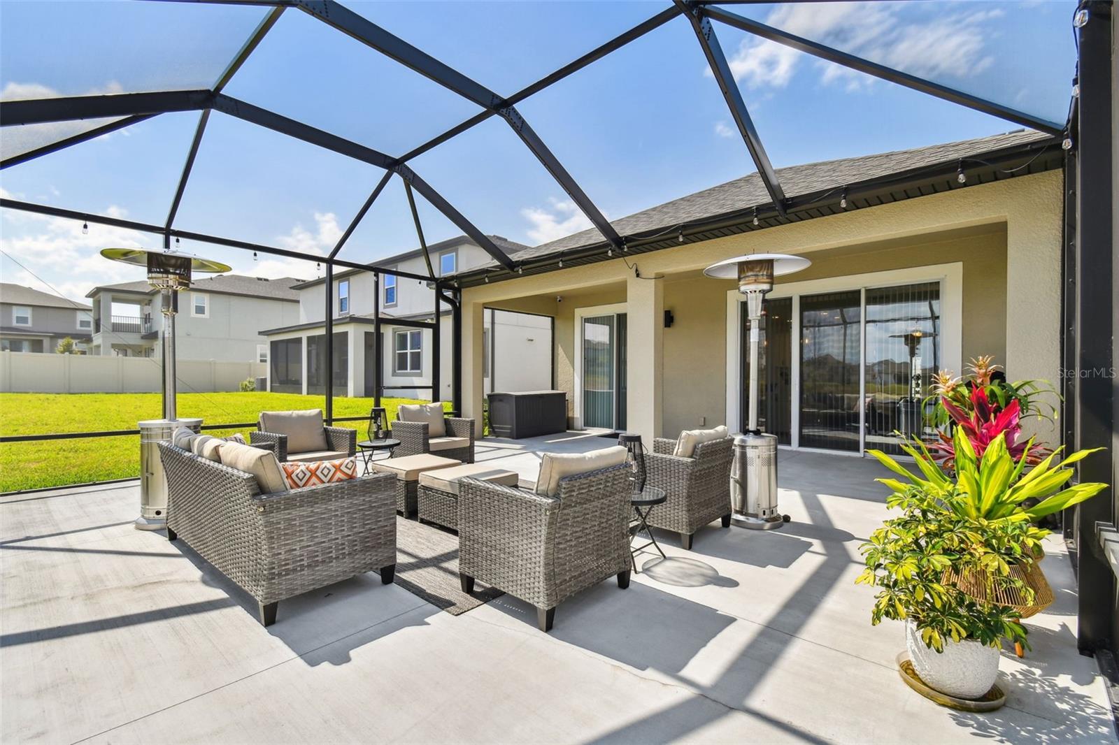 This is a well designed space, which comfortably can seat a gethering and also still has space under the covered roof. Get creative and add your favorite ideas whether a bar, TV gathering area for the game, or a relaxing retreat. This is a generous lot and your neighbors have room to breathe too!