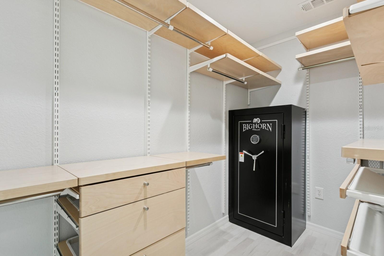 Primary bedroom walk-in closet