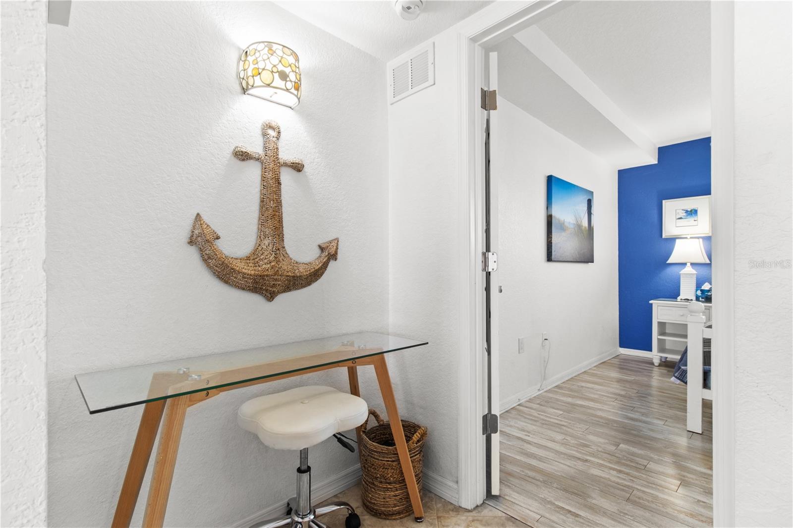 side hall to bedroom 1 with desk