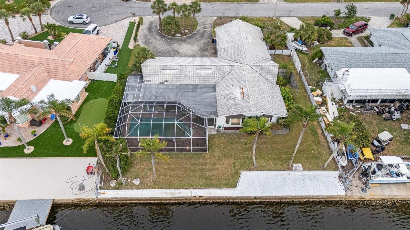 Awesome deep water canal lot with pool and 100' seawall