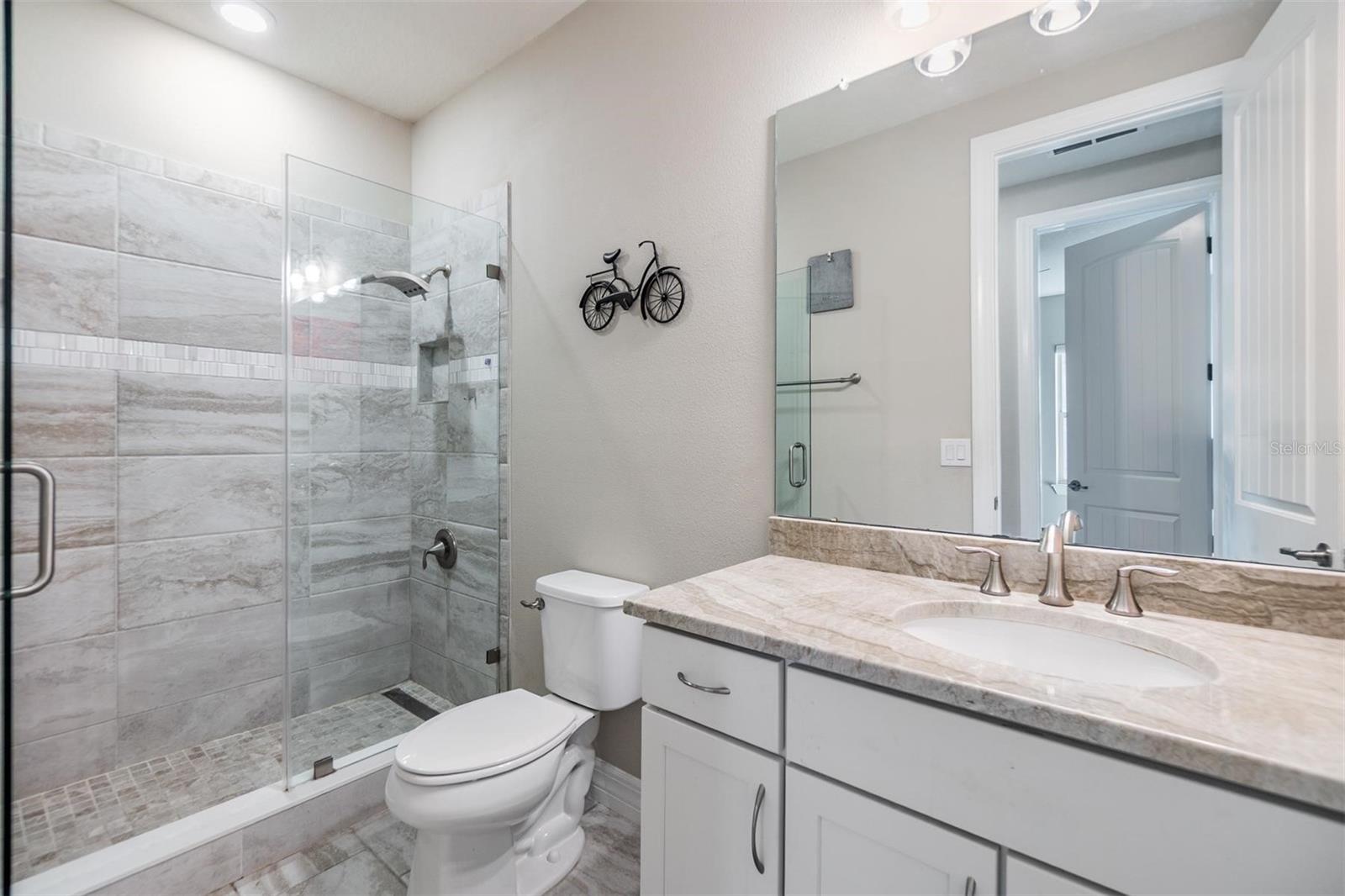 bath #2, upstairs remodeled to walk-in shower with frameless glass shower door