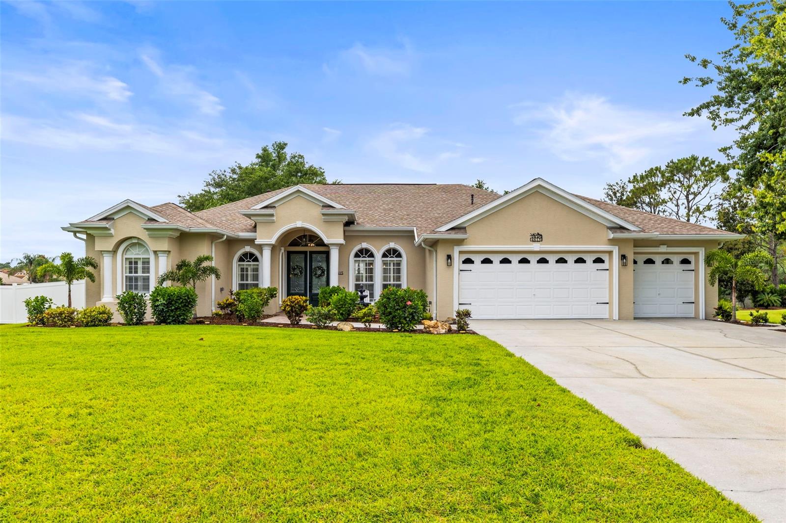 Front of home on 1/2 acre lot fully landscaped