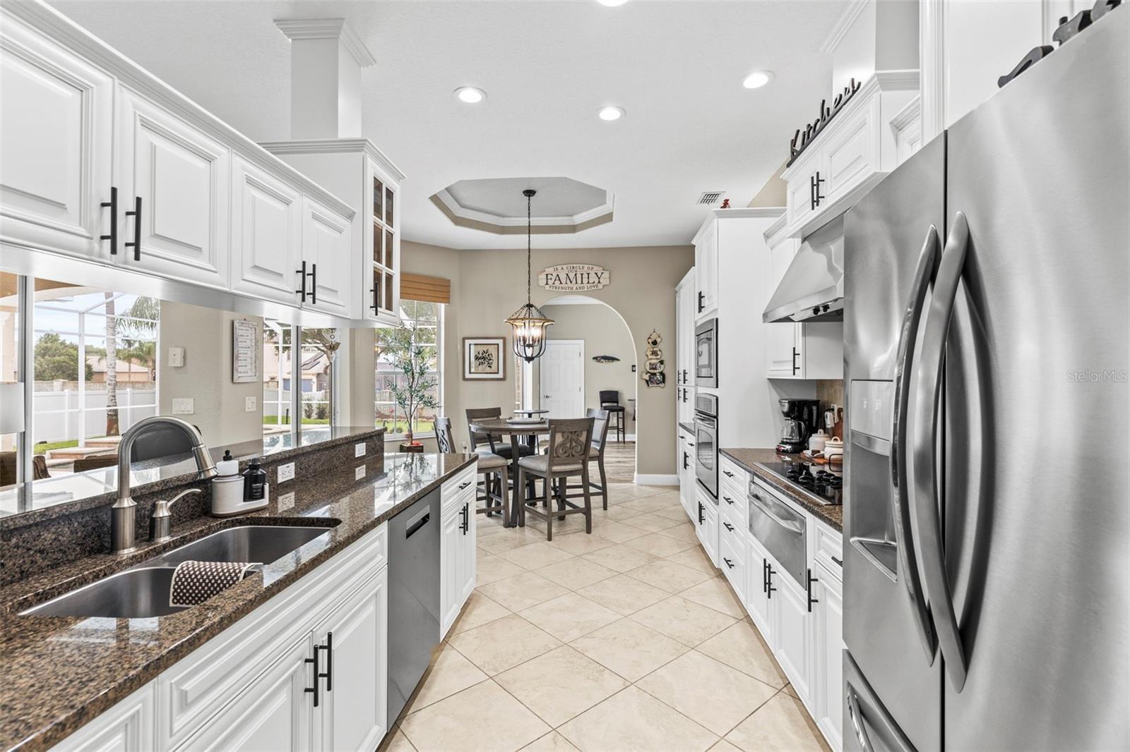 Stainless steel side-by-side refrigerator with freezer drawer