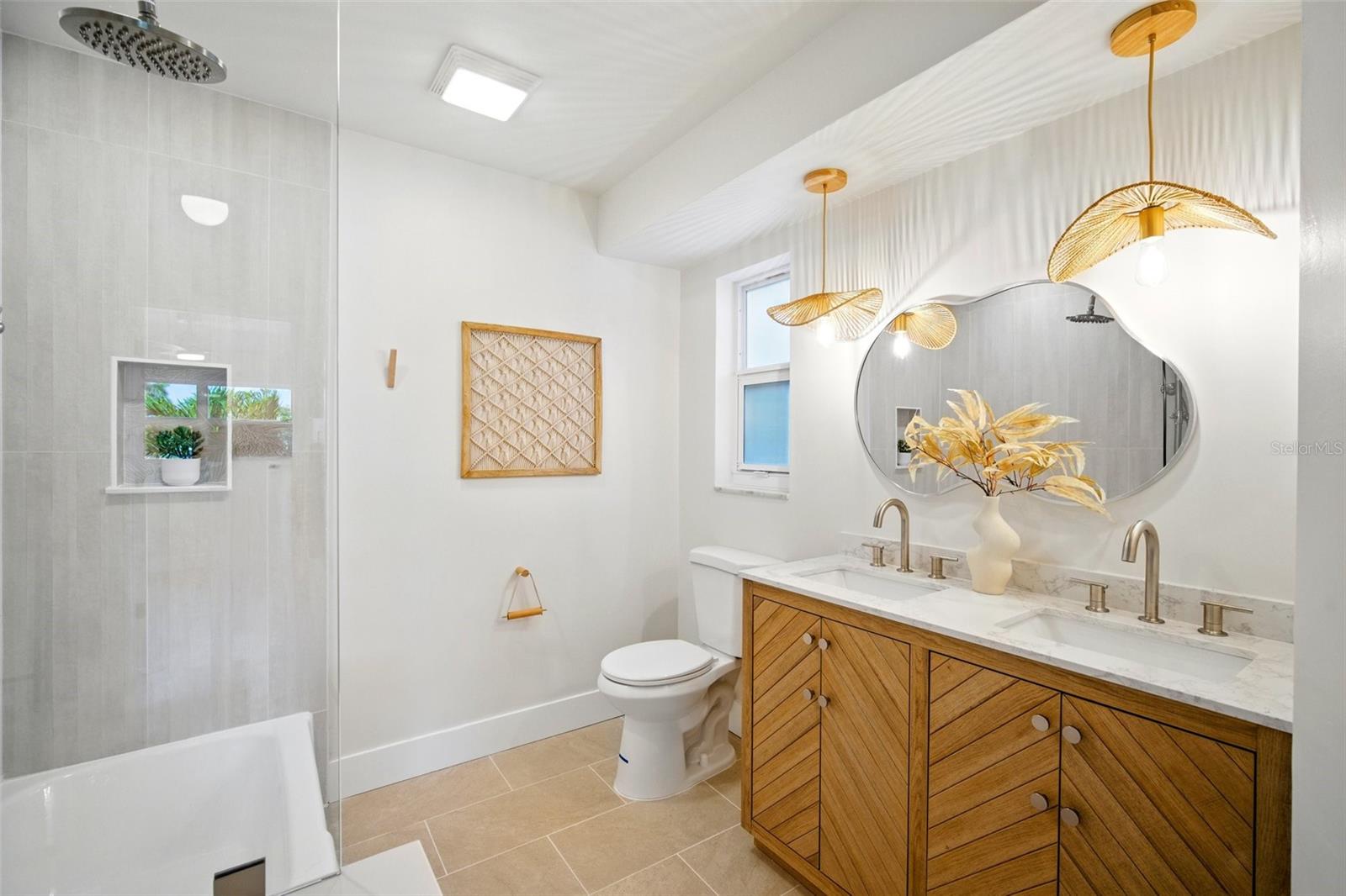 Hallway bathroom with dual vanites