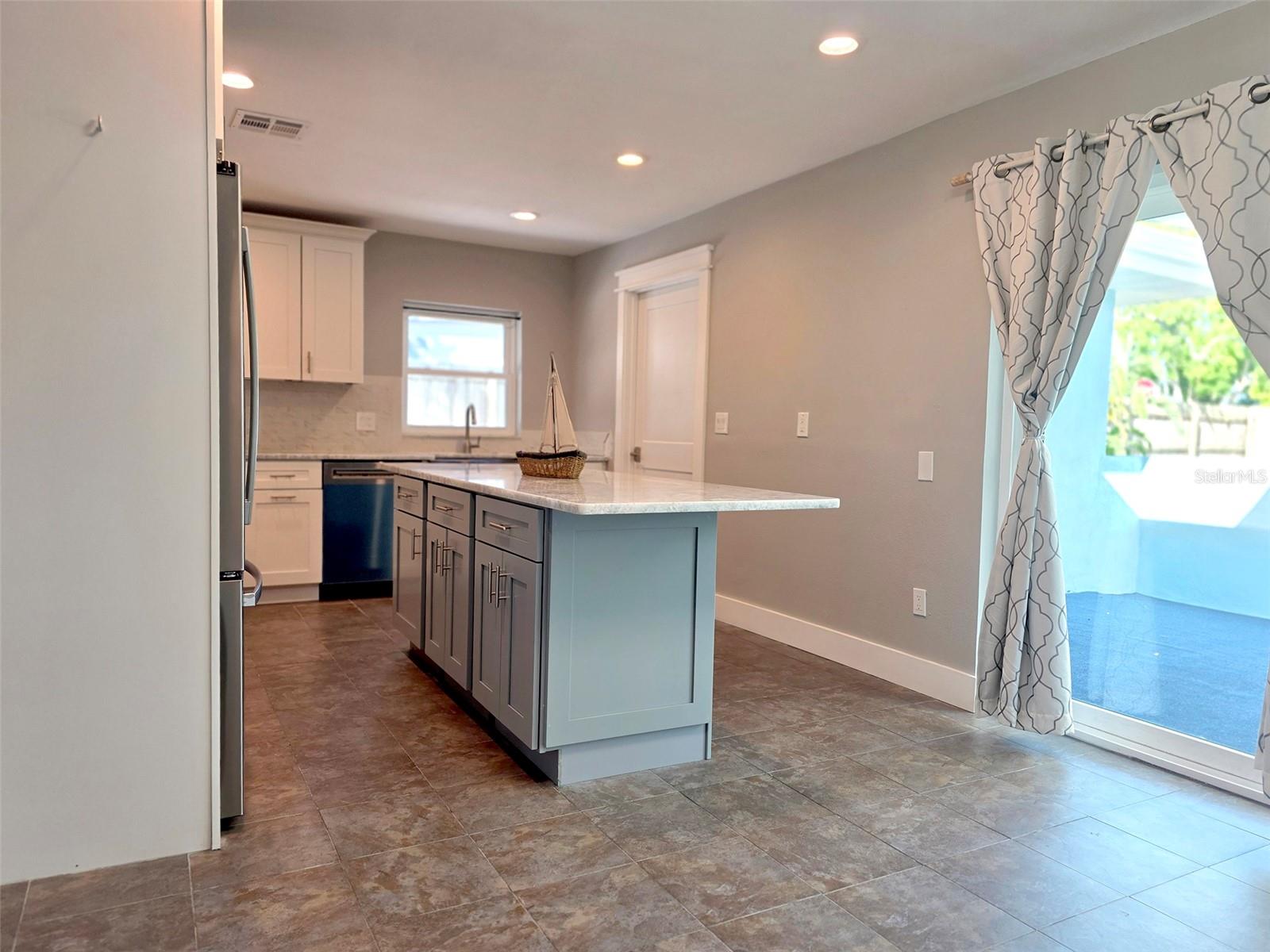 Kitchen / sliders to backyard.