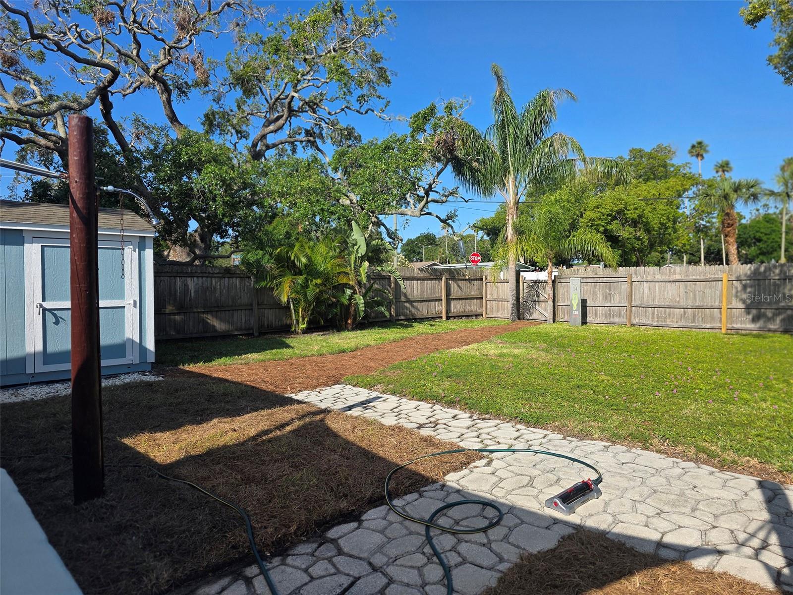 Private gate leading to Pinellas Trail & outdoor shower.