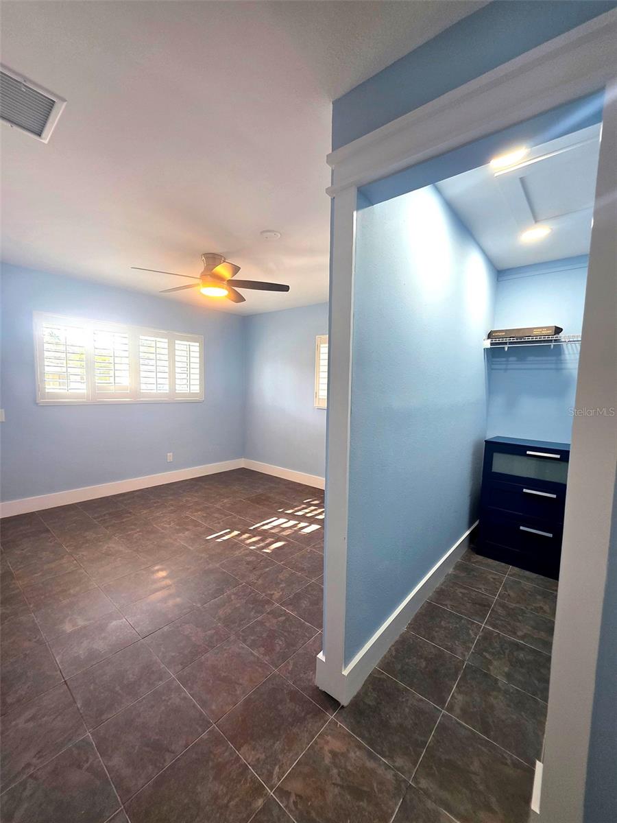 Primary bedroom walk-in closet.