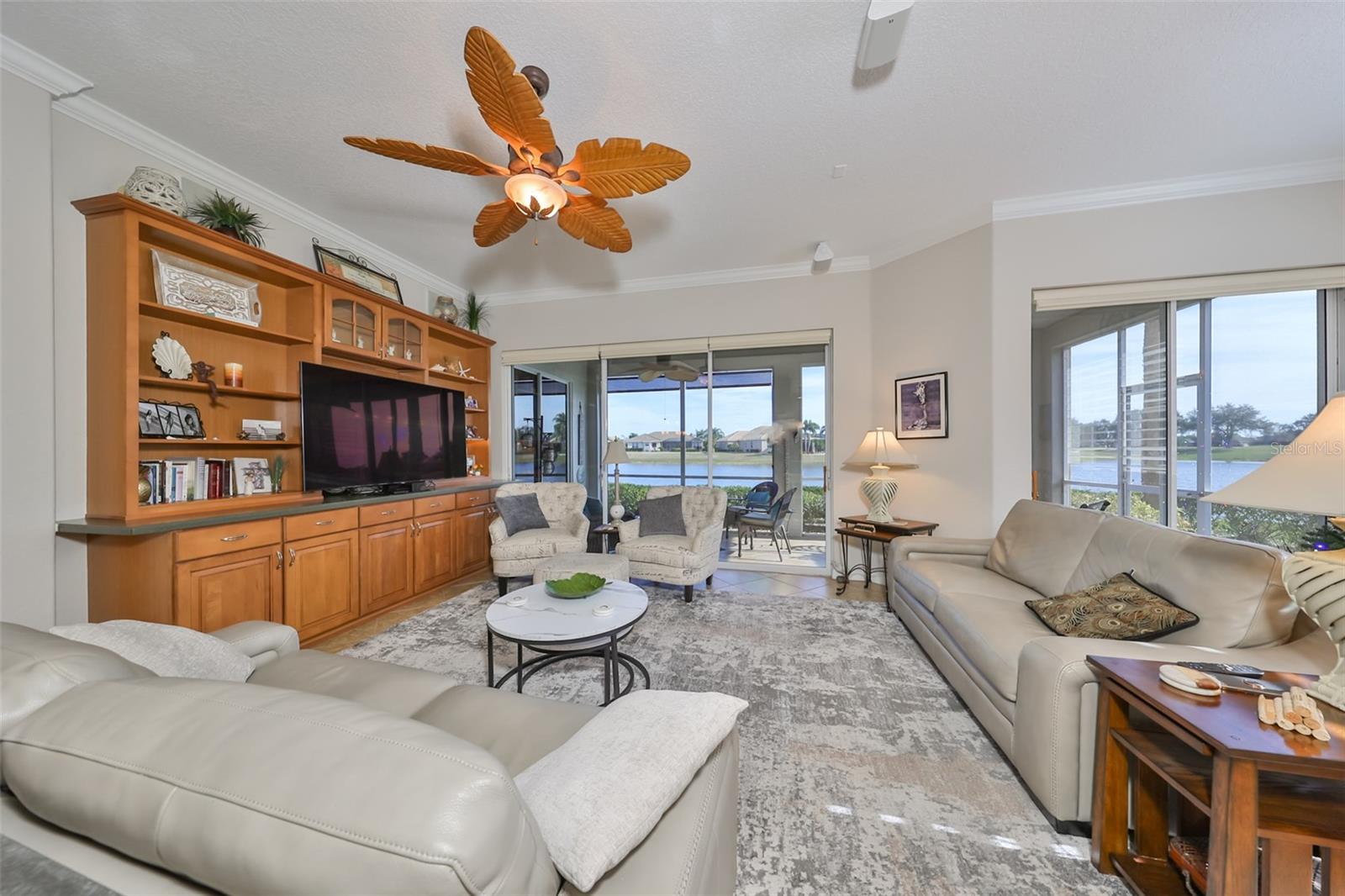 Over size triple and double sliding glass doors bring in massive Florida sunshine.  These doors, as with all of the windows have had a sunshine/hurricane film applied for maximum protection of the elements.