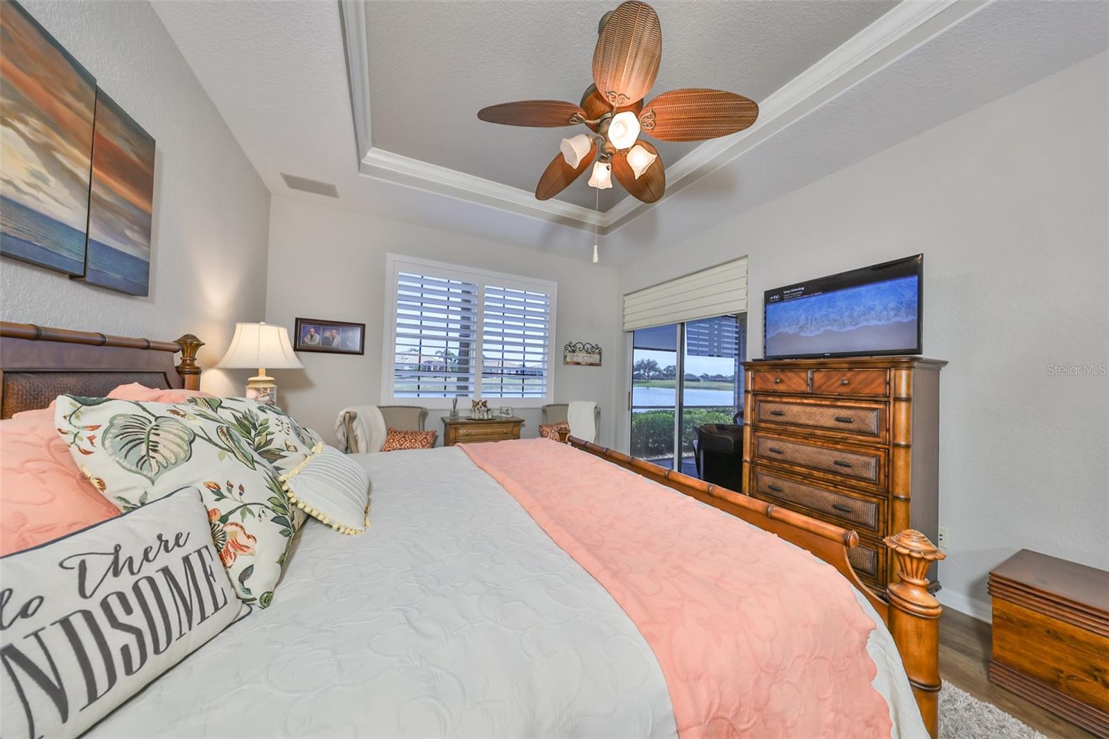 Wonderfully relaxing, with water views, plantation shutters, crown molding and contemporary paint tones.