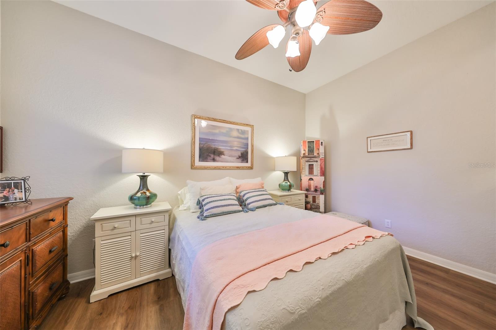 With beautiful flooring, ceiling fan and soft neutral colors.  It is perfect to relax in.