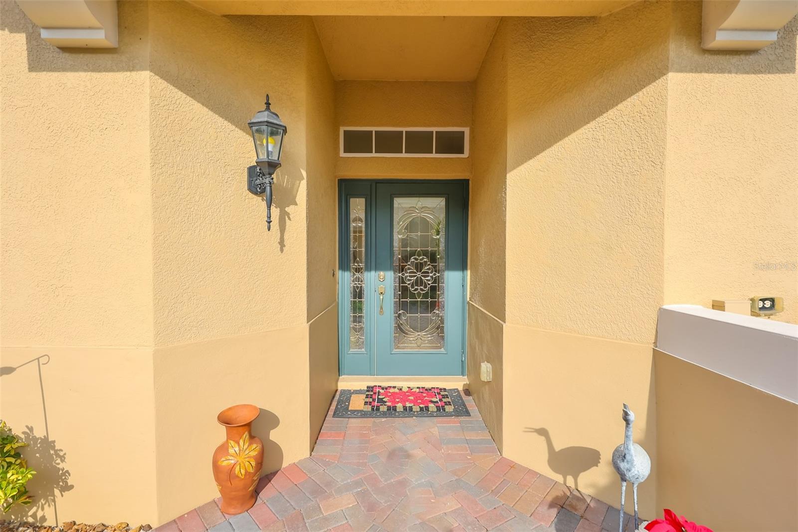 Beautiful lead glass entry door welcomes you and your guests into this stunning updated condo.  No stairs, no elevators, just convenient access.
