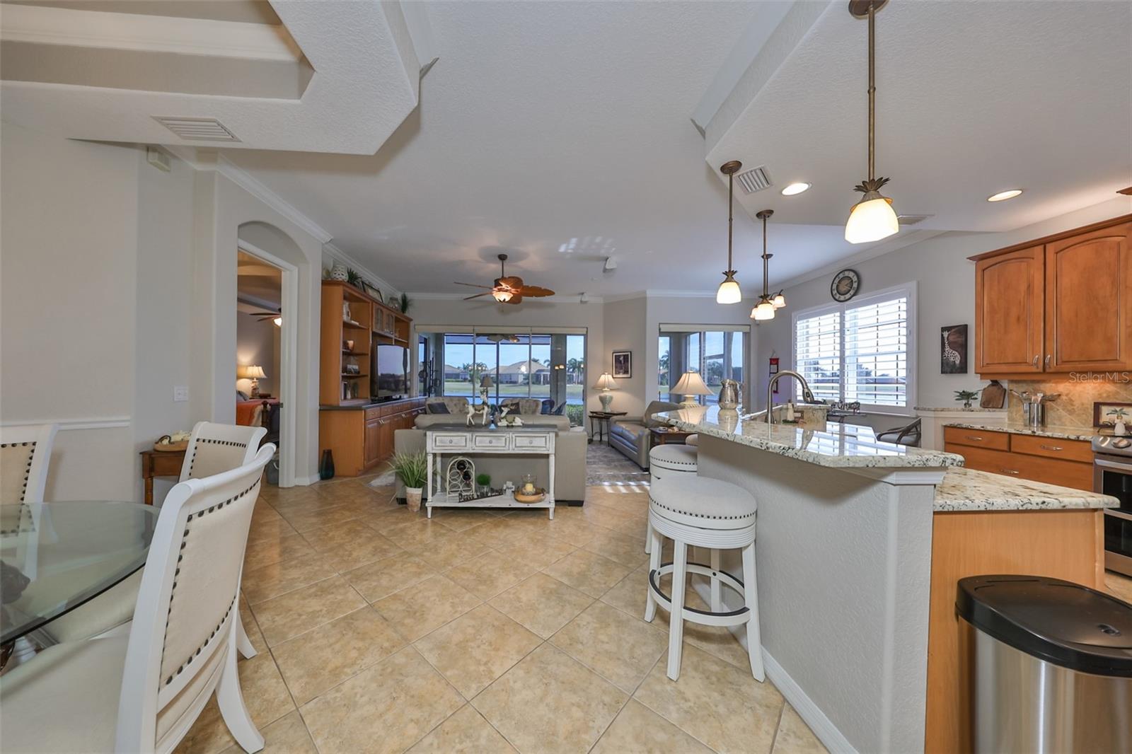 From the foyer you walk right into an OPEN FLOOR plan with a wall to wall water view.