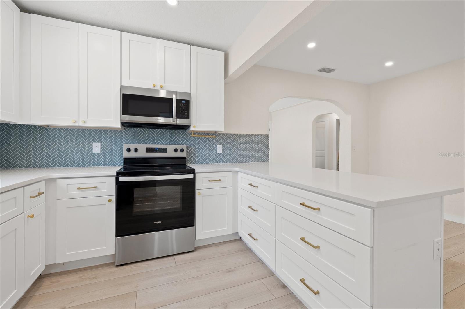 updated kitchen, quart countertops, soft close cabinets and drawers