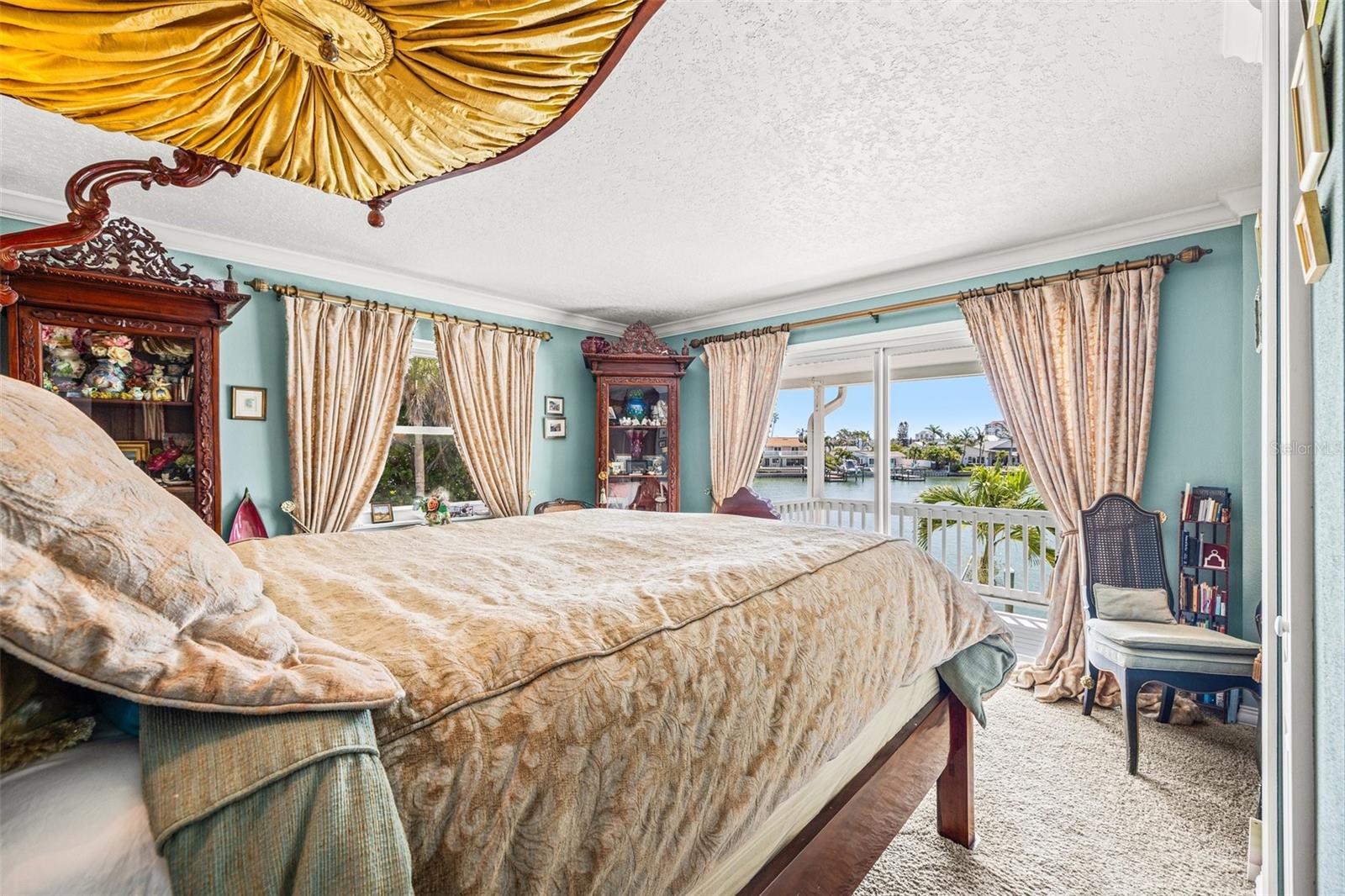 Primary bedroom with stunning views of the water