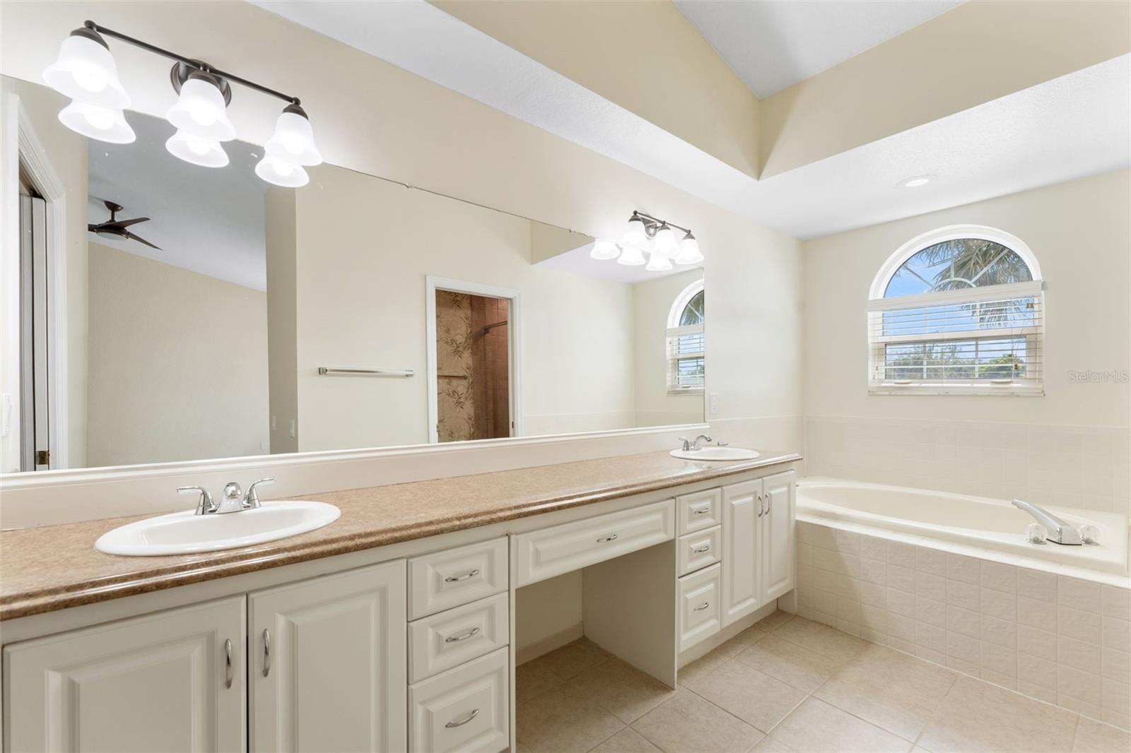 Primary Bathroom dual vanity with powder seat area